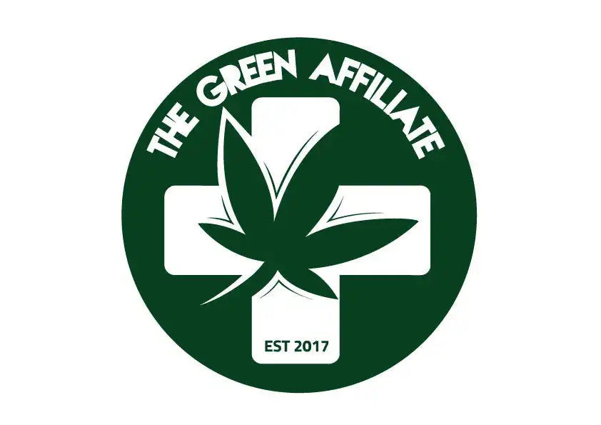 A circular green logo featuring a cannabis leaf overlaid on a medical cross with text reading ’THE GREEN AFFILIATE EST 2017’’